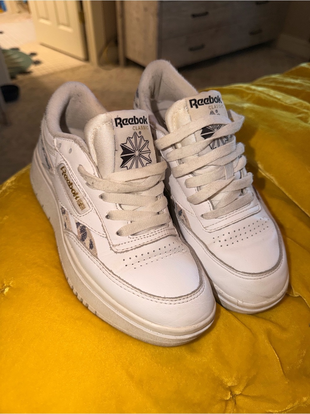 Reebok women’s White Leather Sneakers with Gold Logo Accent cheetah